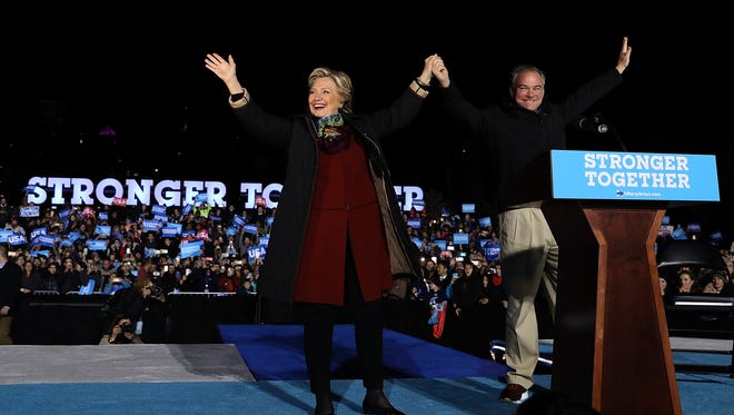 Clinton and Kaine greet supporters during a campaign rally at Dunning-Cohen Champions Field on Oct. 22, 2016, in Philadelphia.