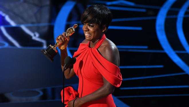 Viola Davis accepts the Oscar for Best Supporting Actress for her role in 'Fences' during the 89th Academy Awards.