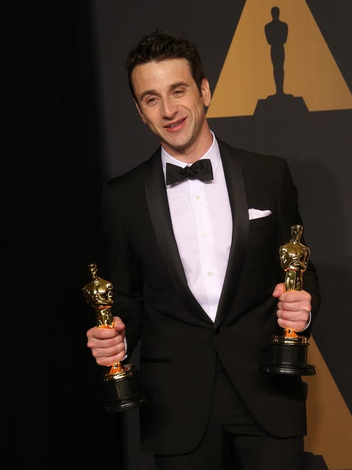 Justin Hurwitz poses with the Oscar for Best Original Score for 'LA LA Land' in the trophy room.