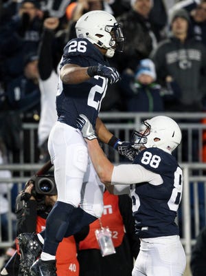 Penn State Nittany Lions running back Saquon Barkley (26) celebrates with tight end Mike Gesicki.