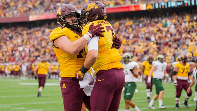 Minnesota Golden Gophers quarterback Mitch Leidner (7) celebrates with Minnesota Golden Gophers tight end Colton Beebe (44) after scoring a touchdown in the first quarter against the Colorado State Rams at TCF Bank Stadium.