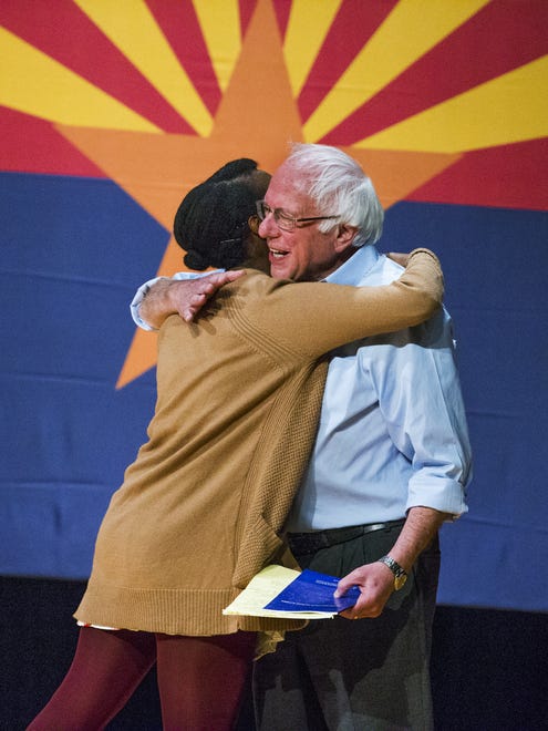 Bernie Sanders hugs NAU student Simone Green after being introduced at a Clinton-Kaine rally inside the Prochnow Auditorium at Northern Arizona University on Tuesday, Oct. 18, 2016.  Many political observers believe that traditionally Republican Arizona is in play for this election.