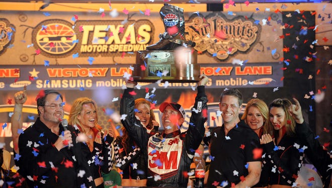 Greg Biffle celebrates in victory lane after winning the Samsung Mobile 500 at Texas Motor Speedway in 2012.