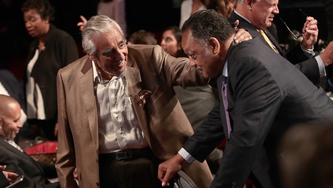 Rep. Charles Rangel, D-NY, talks with with Jesse Jackson prior to the start of the debate.
