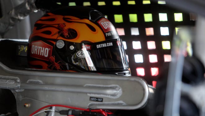 Greg Biffle sits in his car during practice for thee 2014 Sylvania 300 at New Hampshire Motor Speedway, the second race in the Chase for the Sprint Cup.
