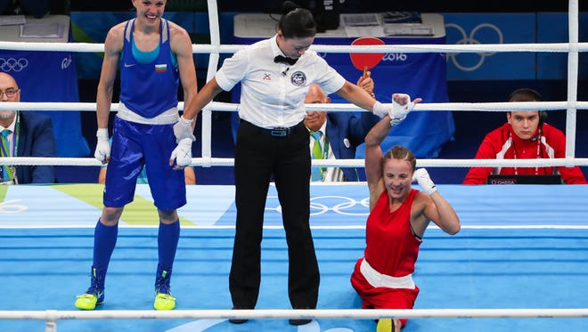 Tetyana Kob of Ukraine celebrates after beating Stanimira Petrova of Bulgaria during women's fly preliminary competition in the Rio 2016 Summer Olympic Games at Riocentro - Pavilion 6.