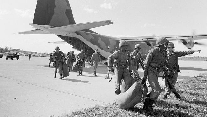 Federal troops land in Selfridge Field, Michigan after President Johnson ordered them to help quell race riots in Detroit, July 24, 1967.  About 5,000 troops were called in.
