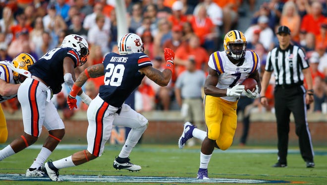 LSU Tigers running back Leonard Fournette (7) carries against the Auburn Tigers during the first quarter at Jordan Hare Stadium.