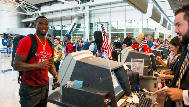 A member of the U.S. Olympic team checks in with United Airlines for his flight to Rio de Janeiro in Houston on Aug. 3, 2016.