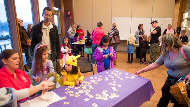 Guests make crafts Friday, Oct. 23, 2015, during Halloween Hoopla at Raccoon River Park in West Des Moines.