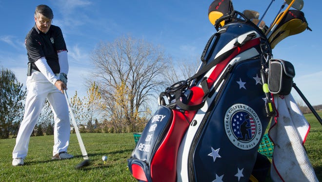 Jeffrey Unger, a disabled Air Force veteran, practices  at the Bob Burns Golf Company and Academy in Appleton.