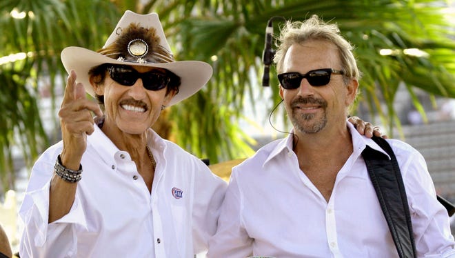 Actor Kevin Costner, right, and NASCAR great Richard Petty get together during a concert given by Costner and his band 'Modern West' before the start of the Coke Zero 400 in 2008.