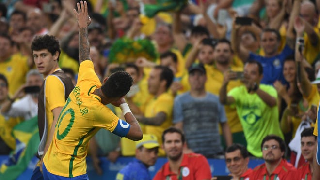 Brazil forward Neymar (10) celebrates after scoring a goal against Germany in the men's gold medal match during the Rio 2016 Summer Olympic Games at Maracana.