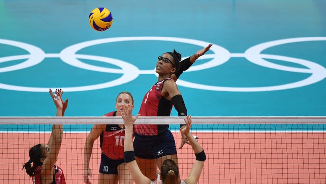 Rachael Adams (5) of the U.S. lines up a spike during a women's volleyball pool play game against Italy. Adams and the U.S. won in four sets.