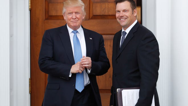 President-elect Donald Trump and Kansas Secretary of State, Kris Kobach meet at the Trump National Golf Club in Bedminster, N.J. Nov. 20, 2016.