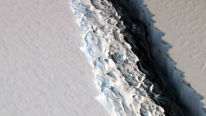 This photo released on Dec. 1, 2016, by NASA shows what scientists photographed in a view of a massive rift in the Antarctic Peninsula's Larsen C ice shelf on Nov. 10, 2016.
