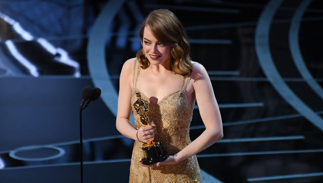 Emma Stone accepts the Oscar for Best Actress for her role in 'La La Land.'