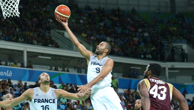 France guard Tony Parker (9) goes up for a shot past Venezuela power forward Nestor Colmenares (43) during the game in the preliminary round of the Rio 2016 Summer Olympic Games.