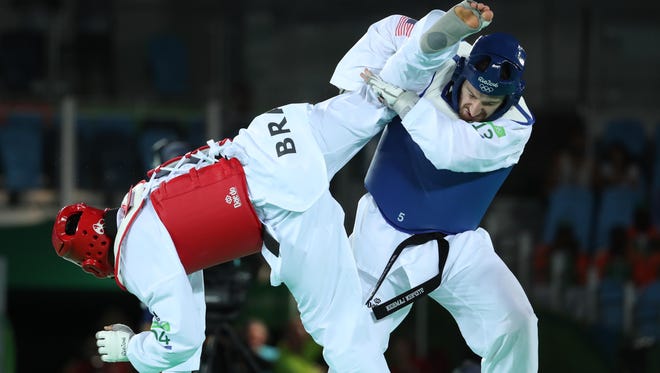 Stephen Lambdin of the United States, right, competes against Maicon Siqueira of Brazil in the men's +80kg round of 16 taekwondo match during the Rio 2016 Summer Olympic Games at Carioca Arena 3.