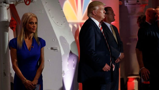 Donald Trump stands with his campaign manager, Kellyanne Conway, left, prior to the Commander in Chief Forum hosted by NBC News on Sept. 7, 2016, in New York.