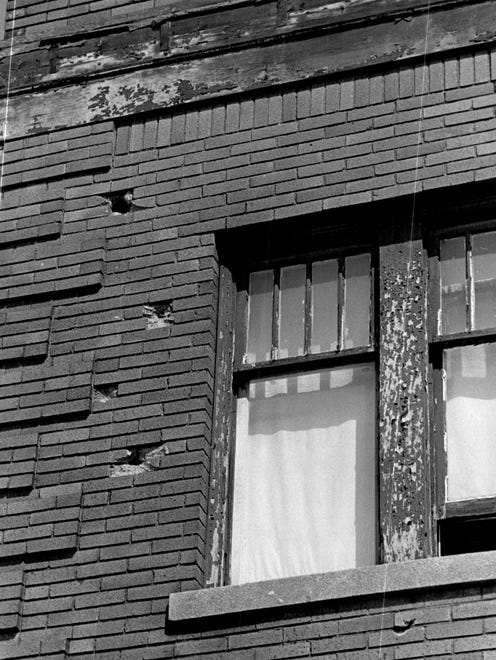 Bullet holes in a building on 12th street during the 1967 Detroit riot.