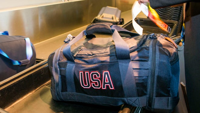 The luggage for a U.S. Olympian is checked at a send-off for the team at Houston Bush Intercontinental on Aug. 3, 2016.