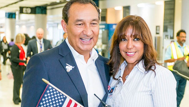 United Airlines CEO Oscar Munoz (left) at a send-off for members of the U.S. Olympic team at Houston Bush Intercontinental on Aug. 3, 2016.