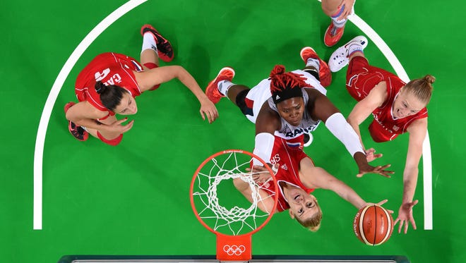 Isabelle Yacoubou of France and Danielle Page of Serbia go for a rebound in the women's basketball bronze medal match during the Rio 2016 Summer Olympic Games at Carioca Arena 1.