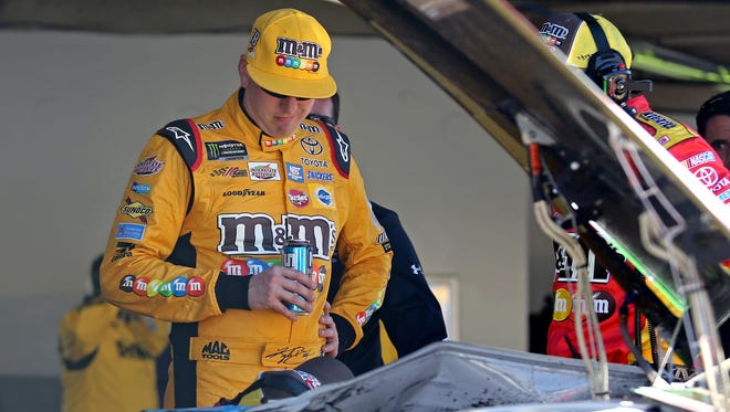 NASCAR Cup Series driver Kyle Busch looks on in the garage after a wreck during the 2017 Daytona 500.