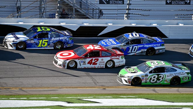 Michael Waltrip (15), Kyle Larson (42) , Danica Patrick (10) and Michael Waltrip (83)  race during the second segment. Waltrip is racing in his 30th and final Daytona 500.