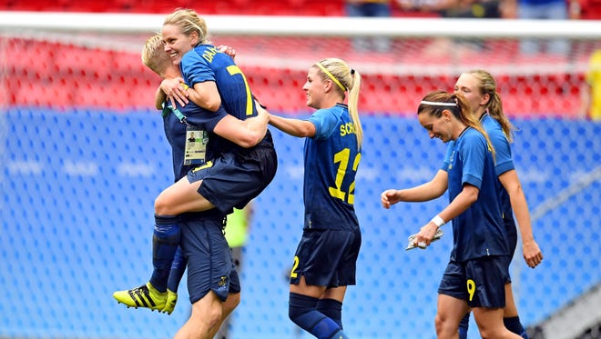 Sweden celebrates its stunning upset of the U.S. in the women's soccer quarterfinals.