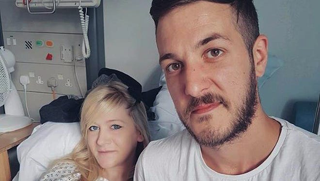 This is an undated hand out photo of Chris Gard and Connie Yates with their son Charlie Gard provided by the family, at Great Ormond Street Hospital, in London.