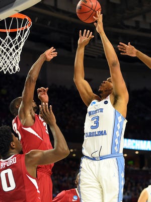 North Carolina Tar Heels forward Kennedy Meeks (3) shoots the ball against Arkansas Razorbacks forward Moses Kingsley (33) during the first half in the second round of the 2017 NCAA tournament at Bon Secours Wellness Arena.