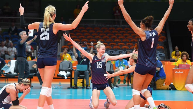 Team USA celebrates winning the women's volleyball bronze medal match.