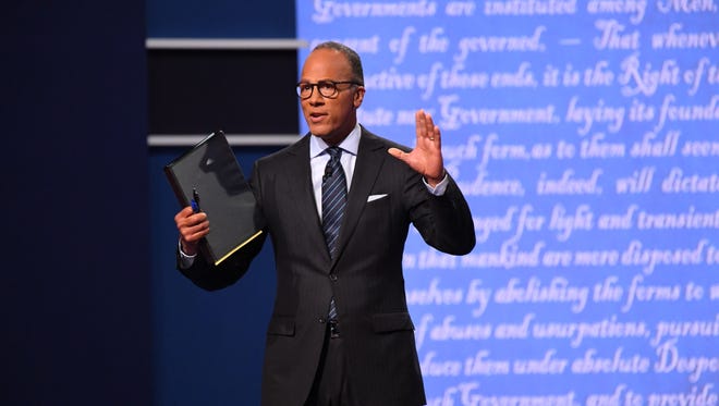 Moderator Lester Holt from NBC takes the stage before the first presidential debate at Hofstra University between Democratic presidential candidate Hillary Clinton and Republican presidential candidate Donald Trump.