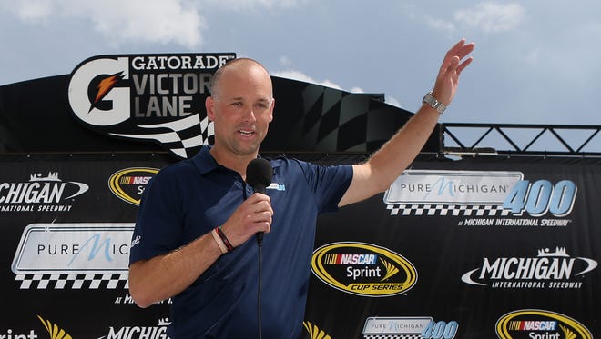 Detroit Red Wings head coach Jeff Blashill gives the drivers the command to start engines prior to the NASCAR Sprint Cup Series race at Michigan International Speedway.
