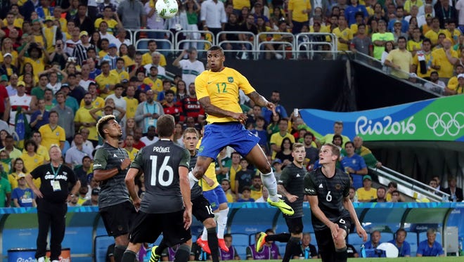 Brazil player Walace (12) heads the ball against Germany in the men's gold medal match during the Rio 2016 Summer Olympic Games at Maracana.