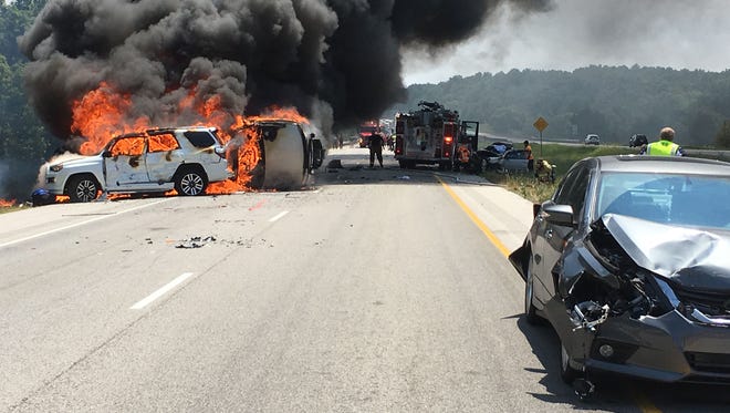 Fire erupts Aug. 4, 2017, minutes after a semi-truck plowed full speed into cars stopped for construction on Interstate 24 in southern Illinois, near its junction with I-57.