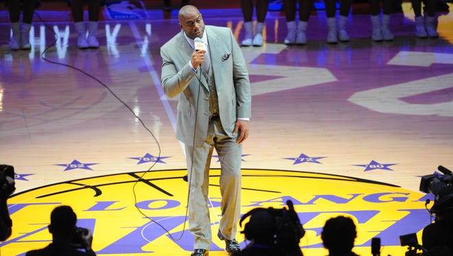 Los Angeles Lakers former player Earvin "Magic" Johnson introduces Lakers forward Kobe Bryant (not pictured) before a game against the Utah Jazz at Staples Center.