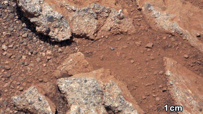 This image provided by NASA shows shows a Martian rock outcrop near the landing site of the rover Curiosity thought to be the site of an ancient streambed. Curiosity landed in a crater near Mars' equator on Aug. 5, 2012.