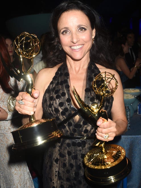 Julia Louis-Dreyfus at the HBO Emmy After Party, holding her Emmys.