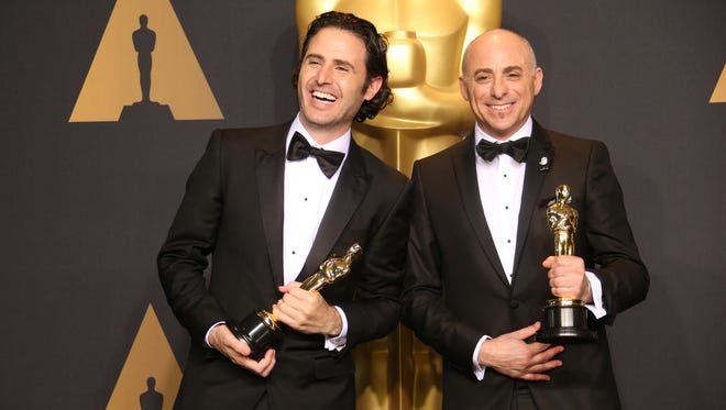 Alan Barillaro and Marc Sondheimer pose with their Oscars for Best Animated Short Film for 'Piper' in the trophy room during the 89th Academy Awards.