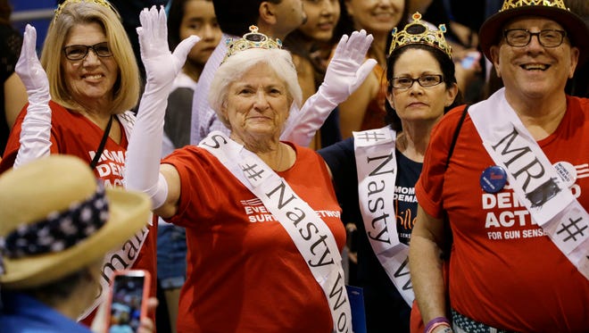 Supporters wear “#Nasty Woman” signs before first lady Michelle Obama addressed the Arizona Democratic Party Early Vote rally at the Phoenix Convention Center on Thursday, Oct. 20, 2016.  Obama is campaigning for Democratic presidential nominee Hillary Clinton.