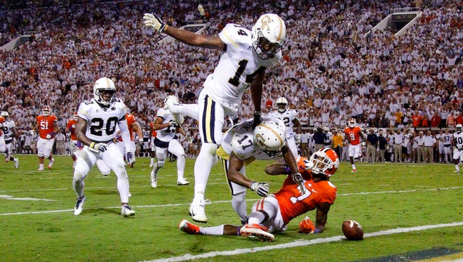 Georgia Tech defensive back Lance Austin (17) fumbles the ball following an interception against Clemson. The play resulted in a safety for the Tigers.