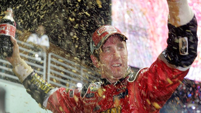 NASCAR driver Greg Biffle celebrates his win following the season finale Ford 400 auto race at Homestead-Miami Speedway  in 2006, the third consecutive year Biffle had won the race.
