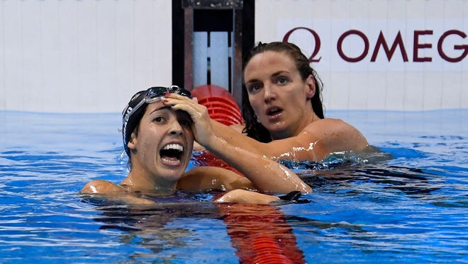 Maya Dirado (USA) celebrates after winning the gold medal over Katinka Hosszu (HUN) during the women's 200-meter backstroke final.