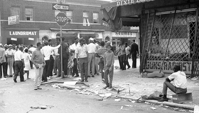 A loan office had been looted at 12th and Taylor in Detroit on July 23, 1967 where racial violence began on Sunday and is continuing with new fires looting and shooting reported.