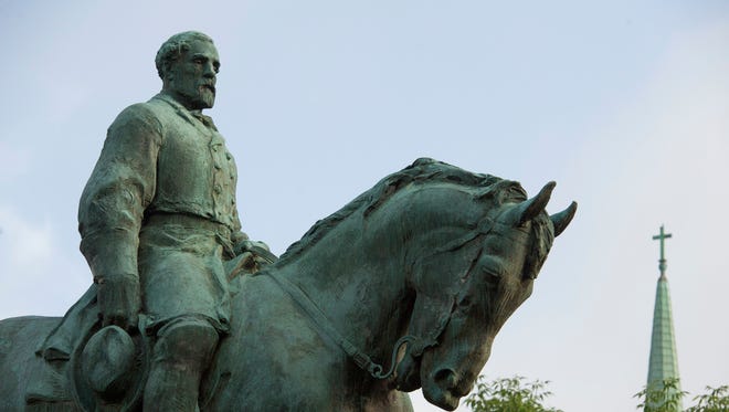 The statue of Confederate Army of Northern Virginia Gen. Robert E. Lee stands in Emancipation Park in Charlottesville, Va.