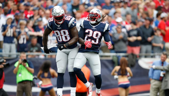 New England Patriots tight end Martellus Bennett (88) and running back LeGarrette Blount (29) celebrate after scoring a touchdown against the Miami Dolphins during the first quarter at Gillette Stadium.