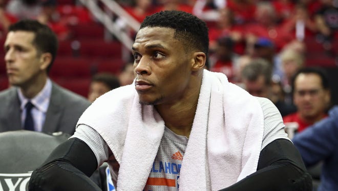 Oklahoma City Thunder guard Russell Westbrook (0) watches from the bench during the fourth quarter against the Houston Rockets in game one of the first round of the 2017 NBA Playoffs at Toyota Center.